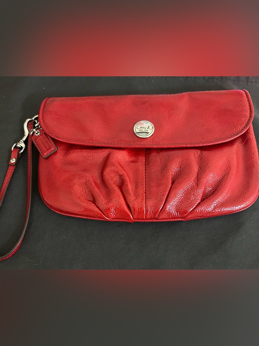 Coach Red Leather Pleated Clutch with Signature Button, with hang tag. EUC